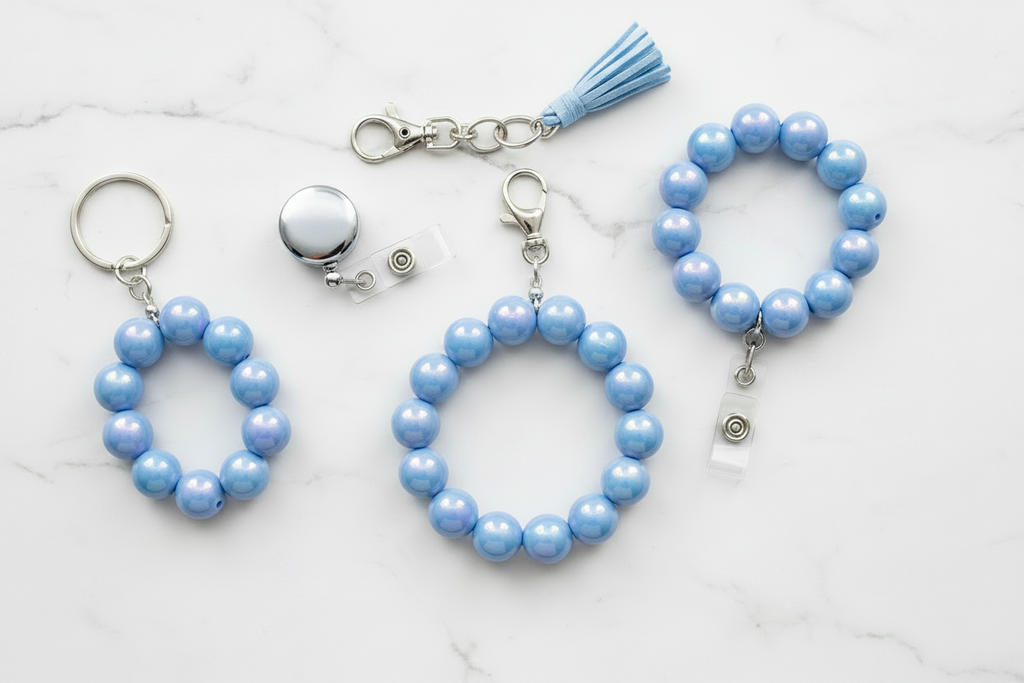 blue iridescent beads shown as blue beaded keychains and a bracelet on a white background