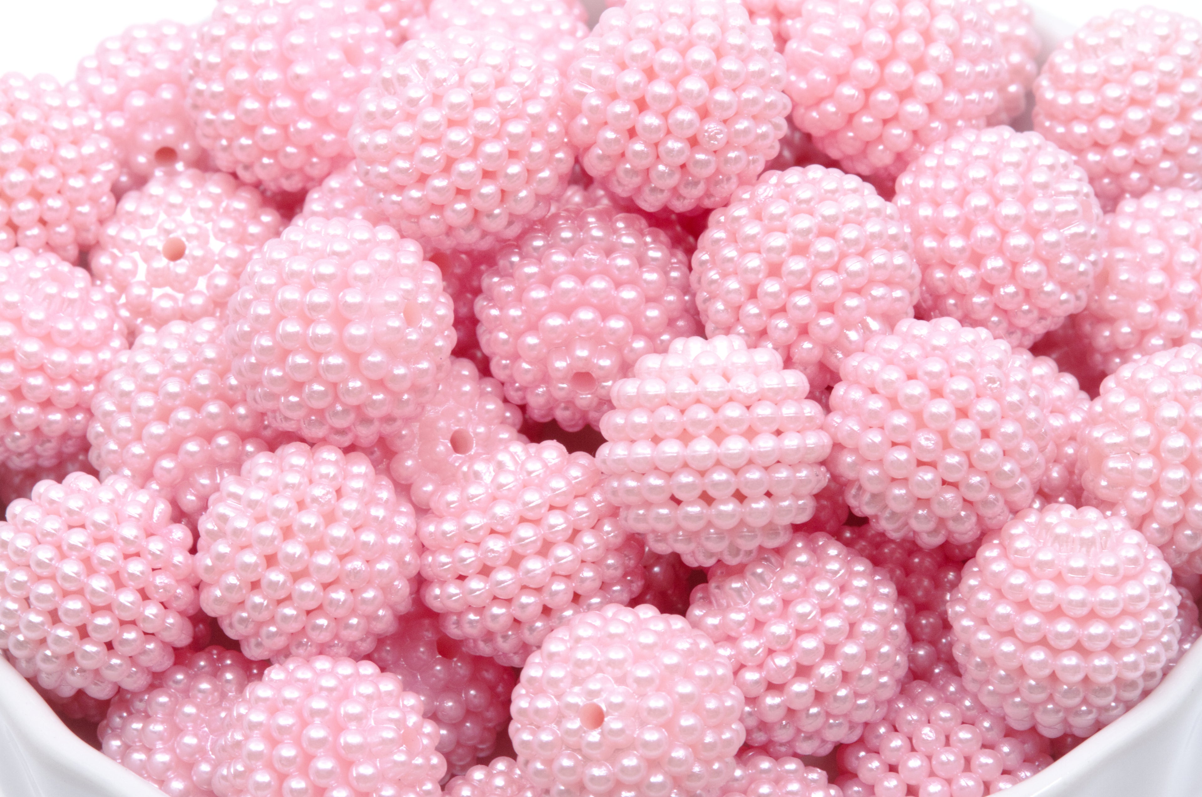 pink bubblegum beads on a white background