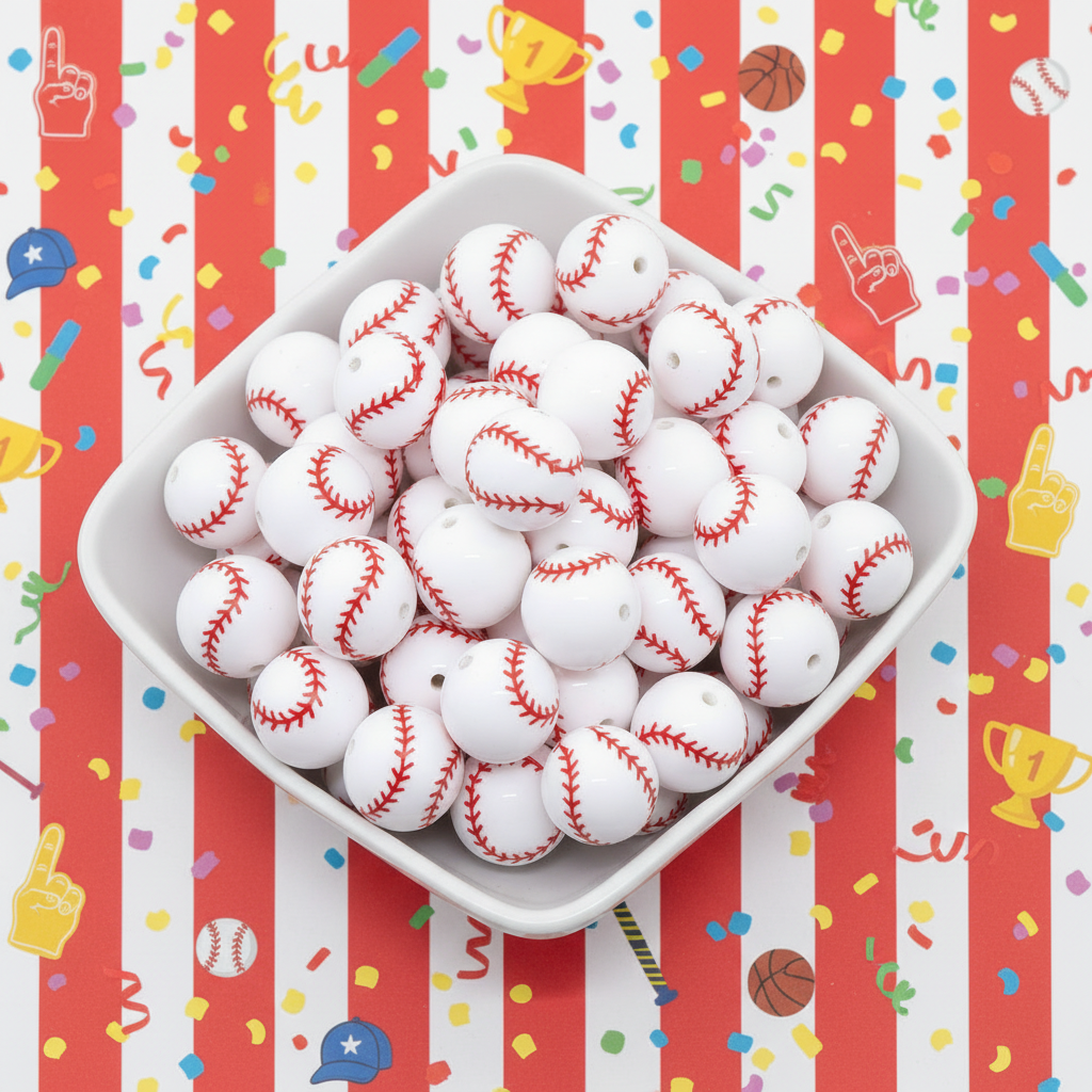 White bowl filled with baseball beads on a red and white striped background with sports-themed decorations.