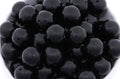 Close-up of black beads on a white background
