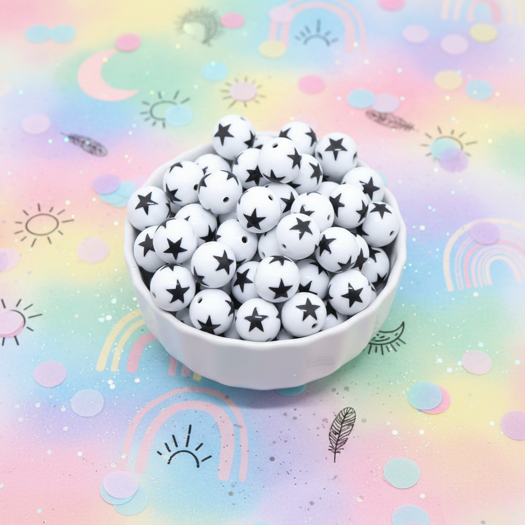 A white ceramic bowl filled with small white beads printed with black stars, set against a pastel rainbow background with cute doodle illustrations.