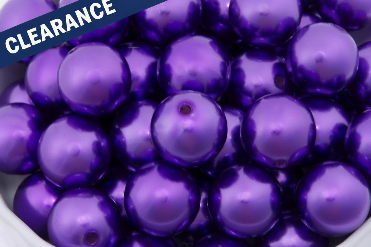  dark purple metallic beads in a white bowl.  'Clearance' label in the top left corner.