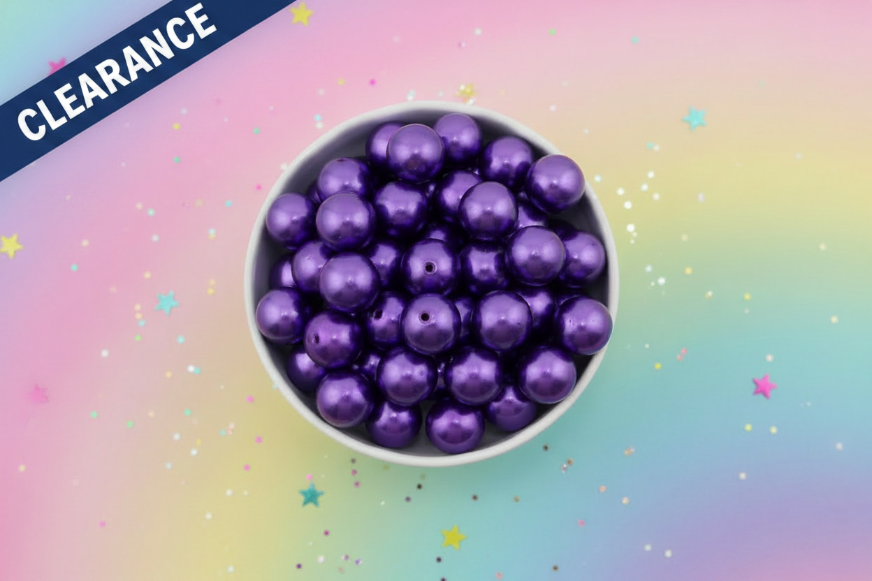 Purple metallic beads in a white bowl on a colorful gradient background with star-shaped confetti. clearance label in top left corner 