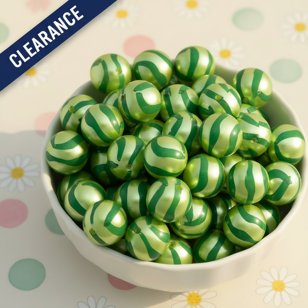 bowl with green striped metallic beads on a daisy background. clearance label on top left corner. 