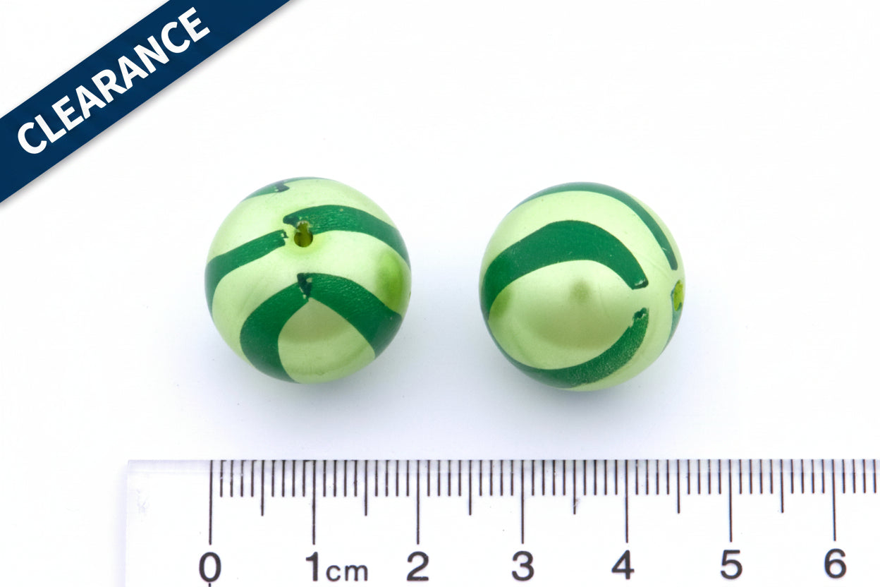 two green striped metallic beads next to a ruler for scale on a white background. clearance label on the top left corner 