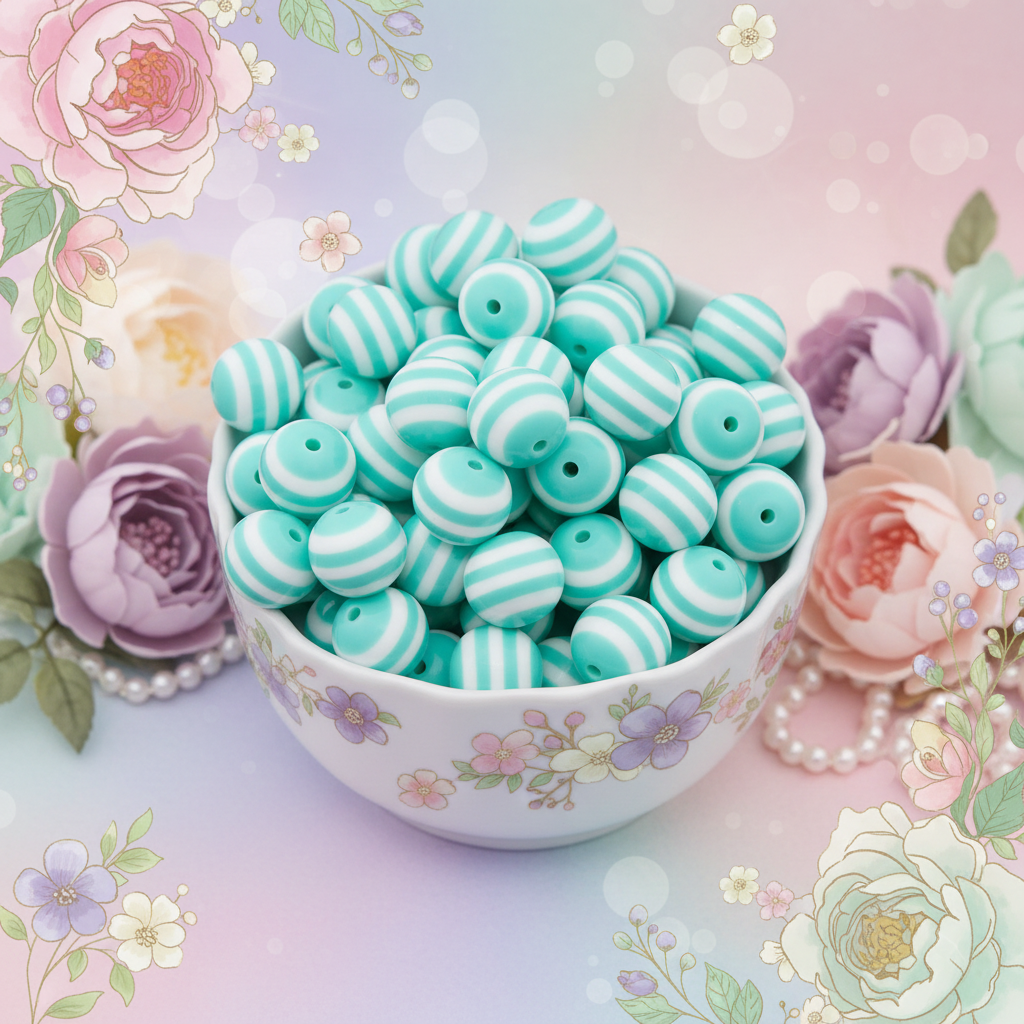 A white ceramic bowl with a floral pattern, filled with mint green and white striped beads, set against a pastel floral background with decorative roses and pearls.
