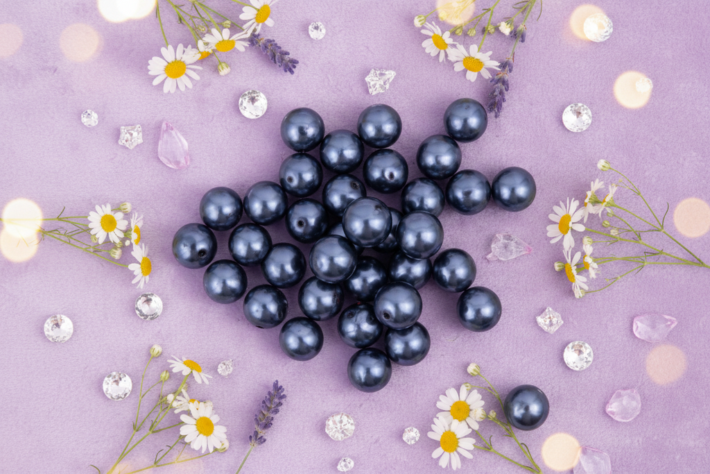 dark blue metallic beads on a purple background with flowers and decorative elements