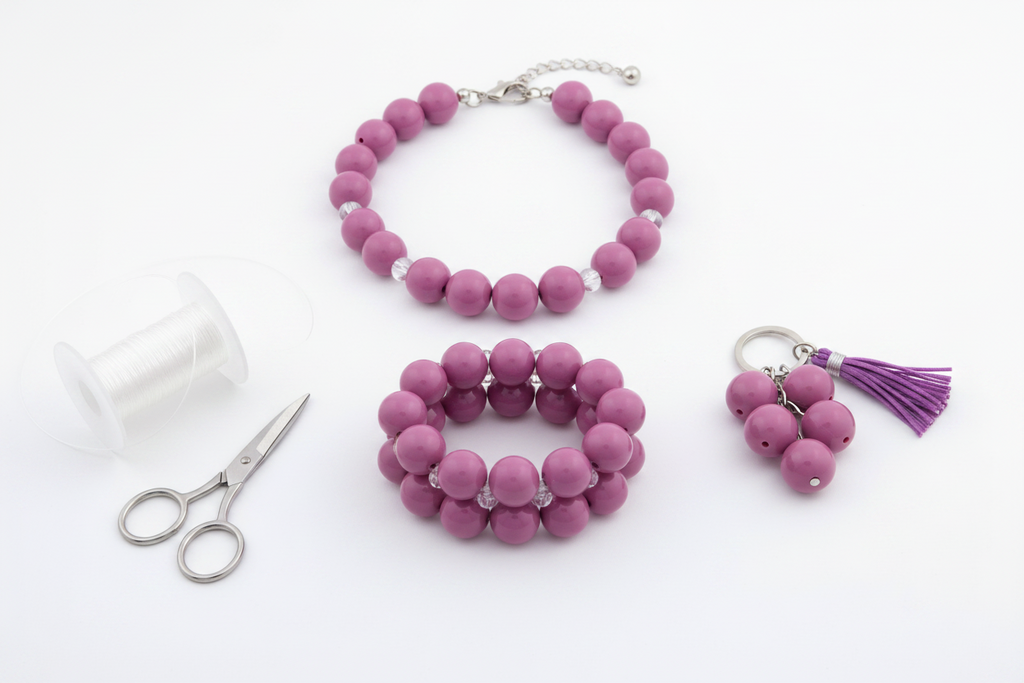 Purple beads shown as  jewelry set with scissors on a white background