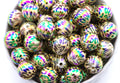 cheetah print round beads in a white bowl with a white background