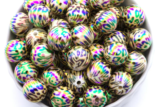 cheetah print round beads in a white bowl with a white background