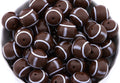 Football beads in a white bowl on a white background 