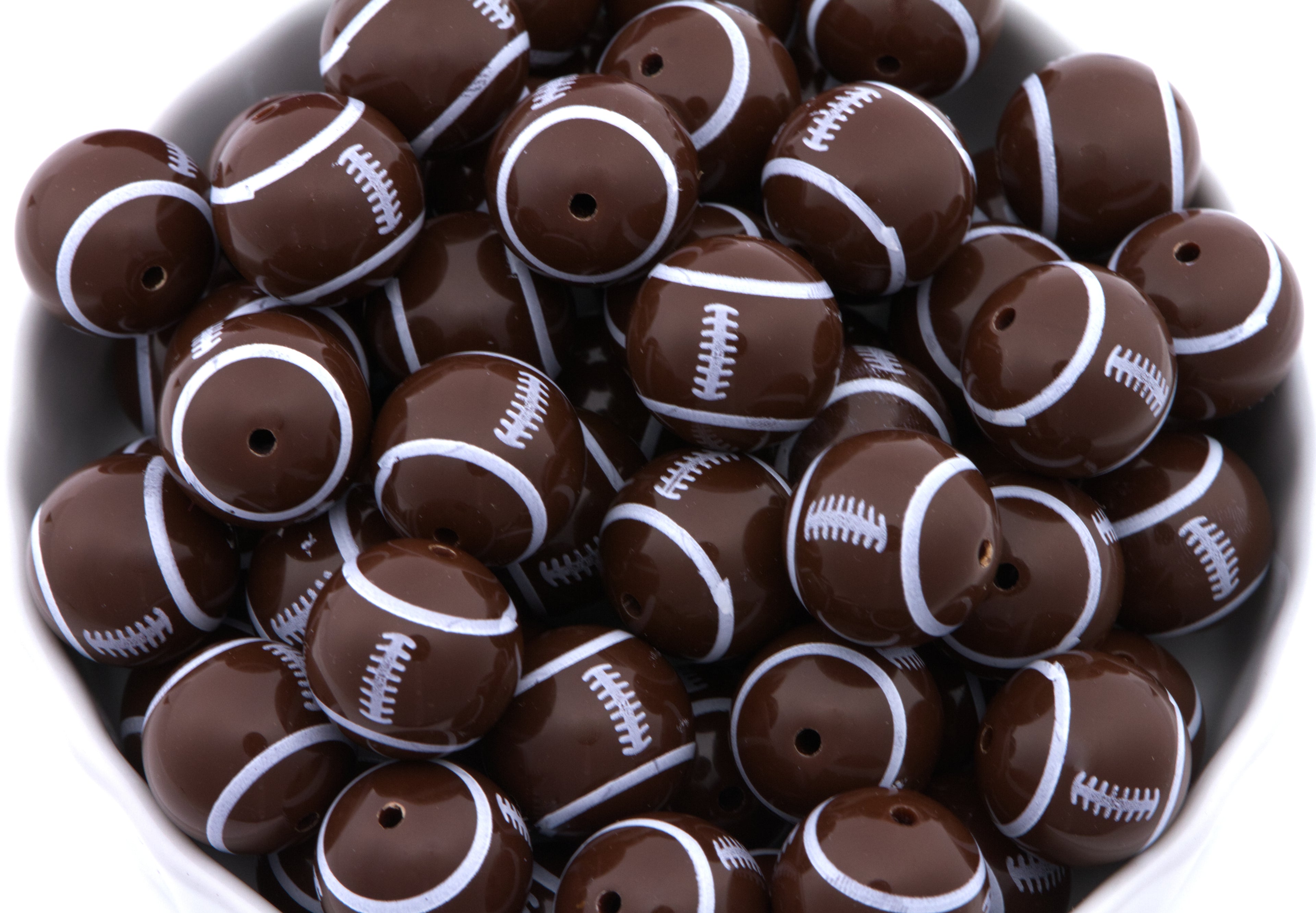 Football beads in a white bowl on a white background 