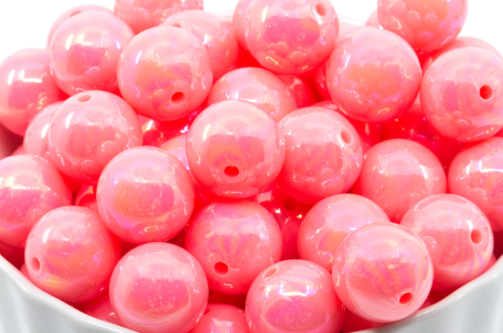 pink iridescent bubblegum beads in a white bowl