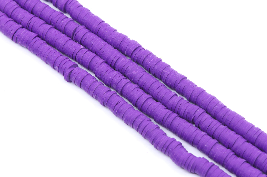 Purple polymer clay disc bead strands, shown diagonally on a plain white background.