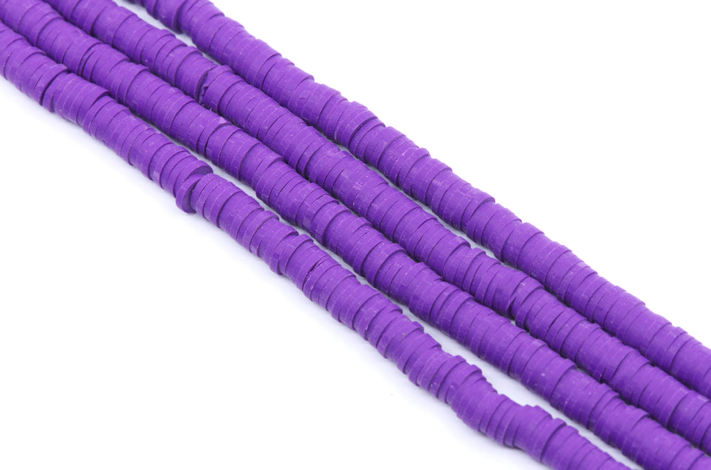 Purple polymer clay disc bead strands, shown diagonally on a plain white background.