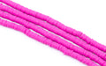 Bright pink strands of polymer clay disc beads, arranged diagonally on a plain white background.
