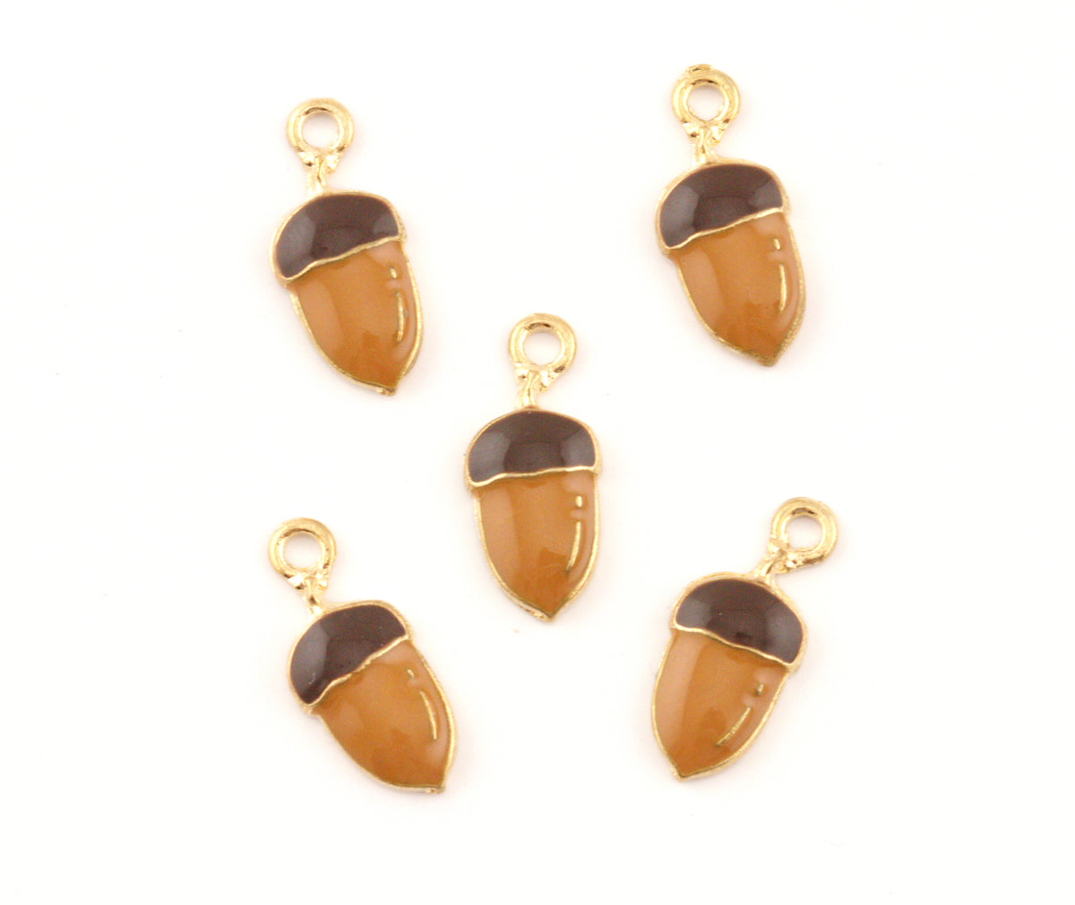 Five acorn-shaped jewelry charms with gold-tone metal frames and loops, featuring a glossy amber-brown body and a dark brown cap, arranged on a plain white background.