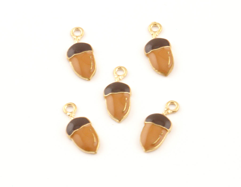Five acorn-shaped jewelry charms with gold-tone metal frames and loops, featuring a glossy amber-brown body and a dark brown cap, arranged on a plain white background.
