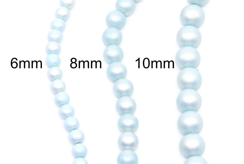 Three strands of light blue shimmery acrylic beads shown in different sizes with size labels reading 6mm, 8mm, and 10mm on a white background.