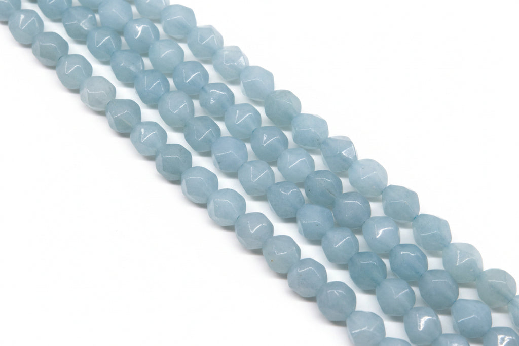 Light blue faceted diamond cut agate beads arranged in four diagonal strands against a solid white background.