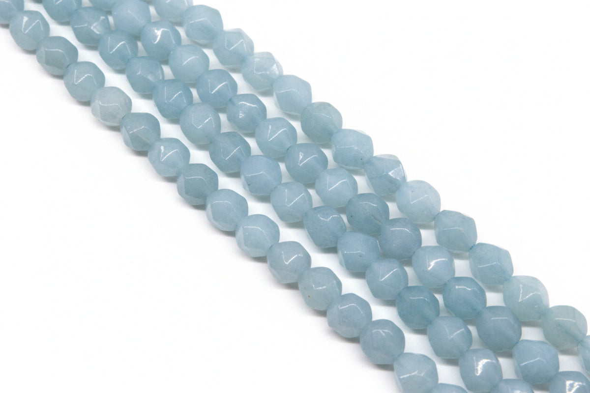 Light blue faceted diamond cut agate beads arranged in four diagonal strands against a solid white background.