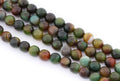 Four strands of polished round faceted agate beads on a white background. The beads feature natural banding with colors of green, brown, orange, and dark gray.