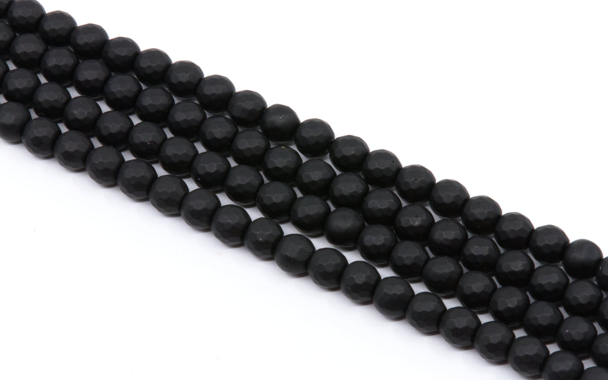 Faceted black round agate beads arranged in four parallel strands on a plain white background.