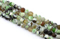 four strands of round faceted agate beads in earthy tones of green, brown, black, and white, arranged diagonally on a white background.