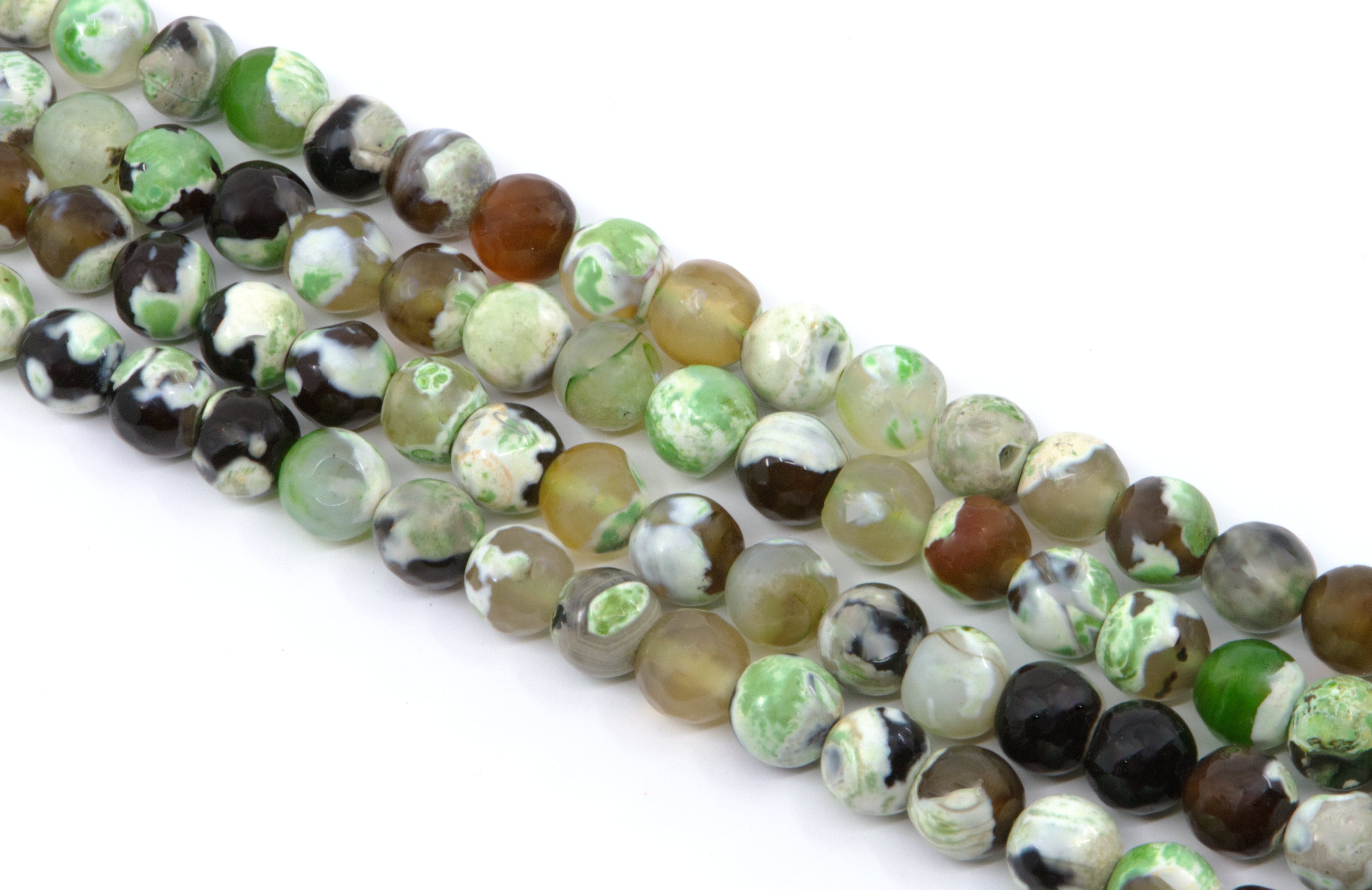 four strands of round faceted agate beads in earthy tones of green, brown, black, and white, arranged diagonally on a white background.