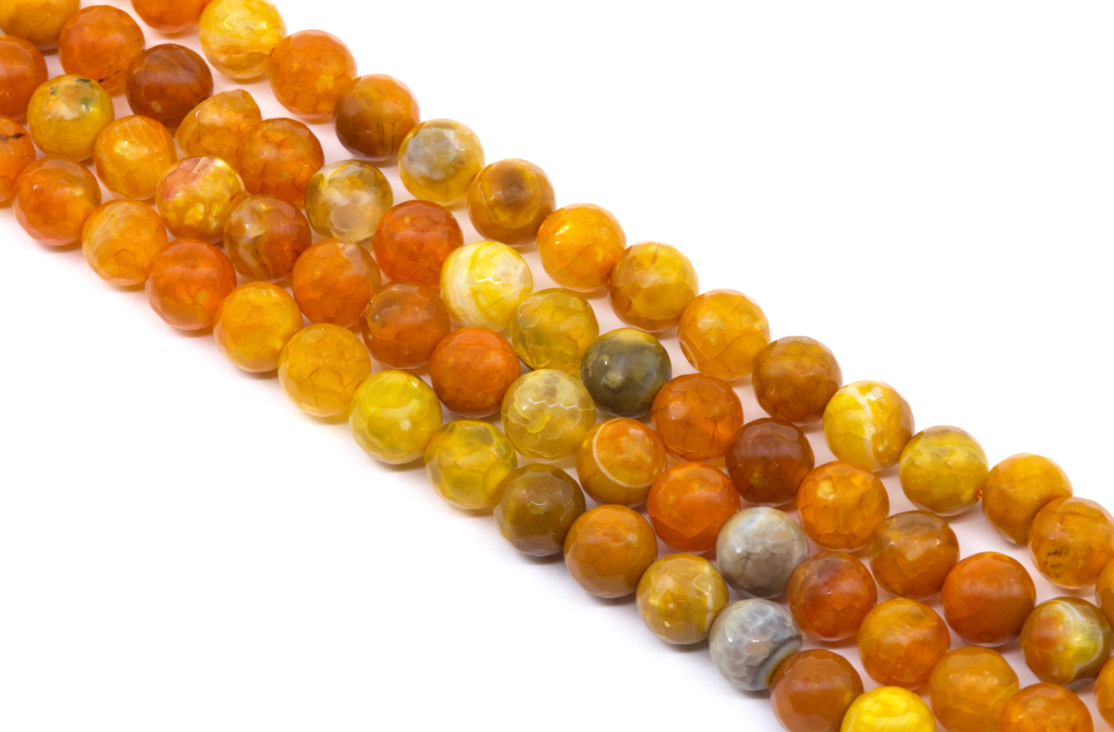 Four strands of faceted round gemstone beads in warm earthy tones, including orange, yellow and gray arranged diagonally on a white background.