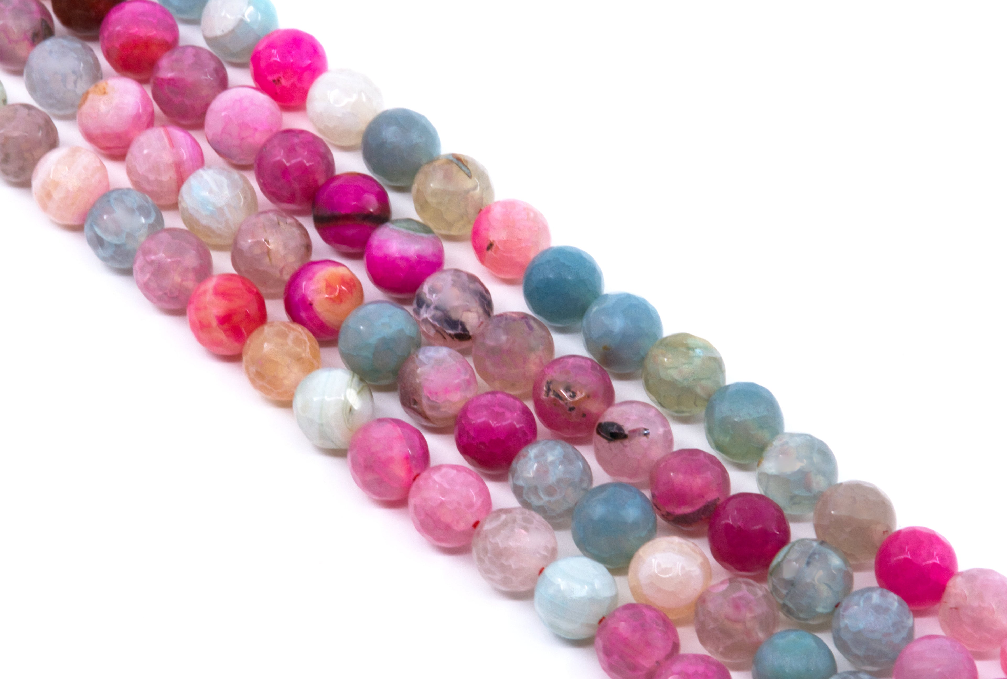 Four strands of faceted round agate beads in various colors including pink, blue, and green, arranged diagonally on a white background.