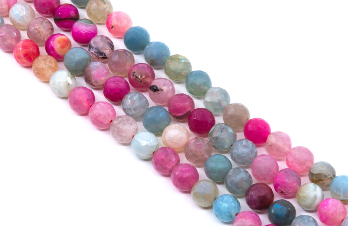 Four strands of faceted round agate beads in various colors including pink, blue, and green, arranged diagonally on a white background.
