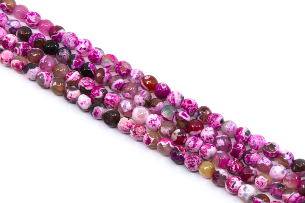 four strands of round faceted agate beads in shades of pink, purple, and white with marbled patterns, arranged diagonally on a white background.