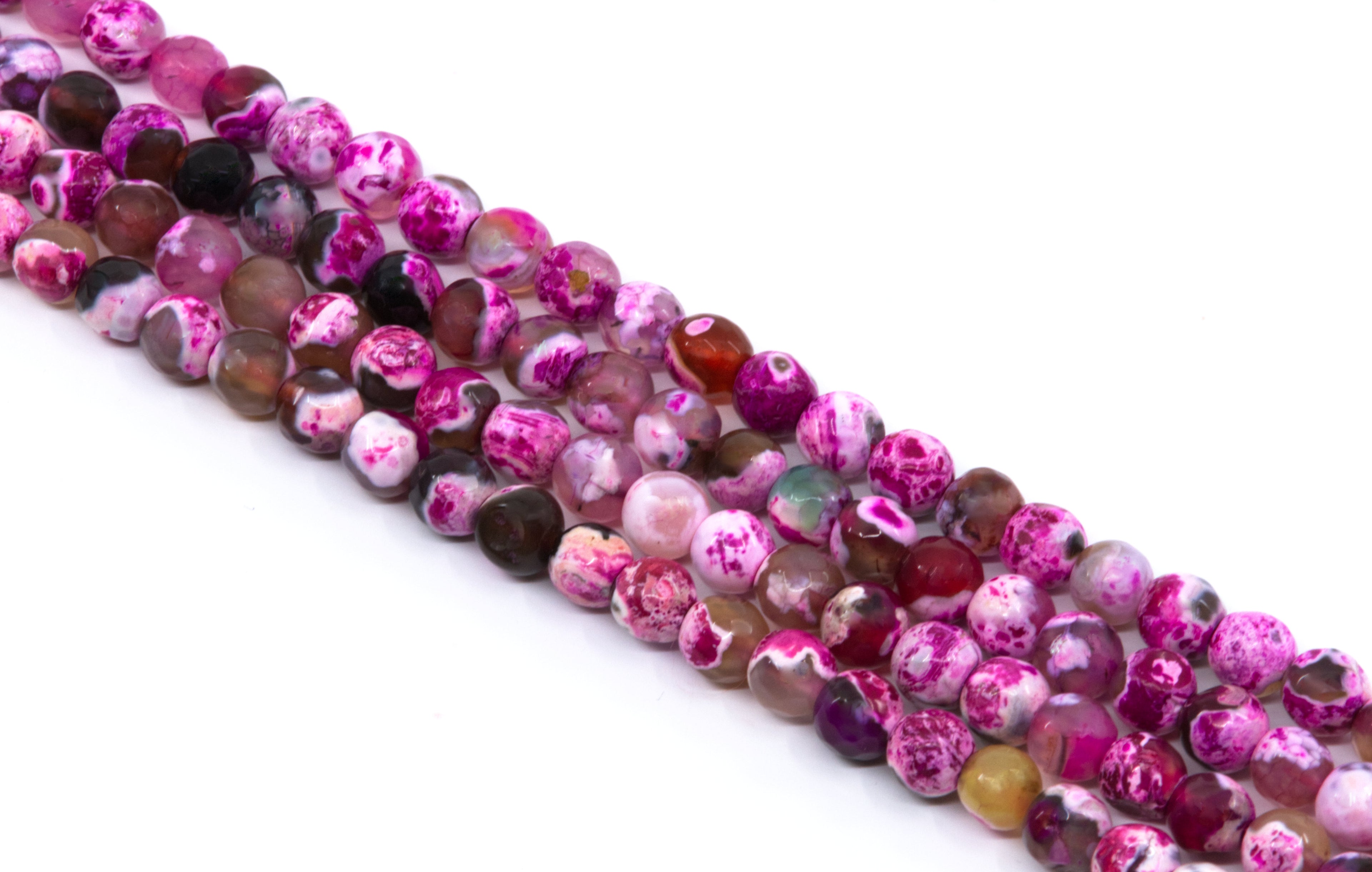 four strands of round faceted agate beads in shades of pink, purple, and white with marbled patterns, arranged diagonally on a white background.