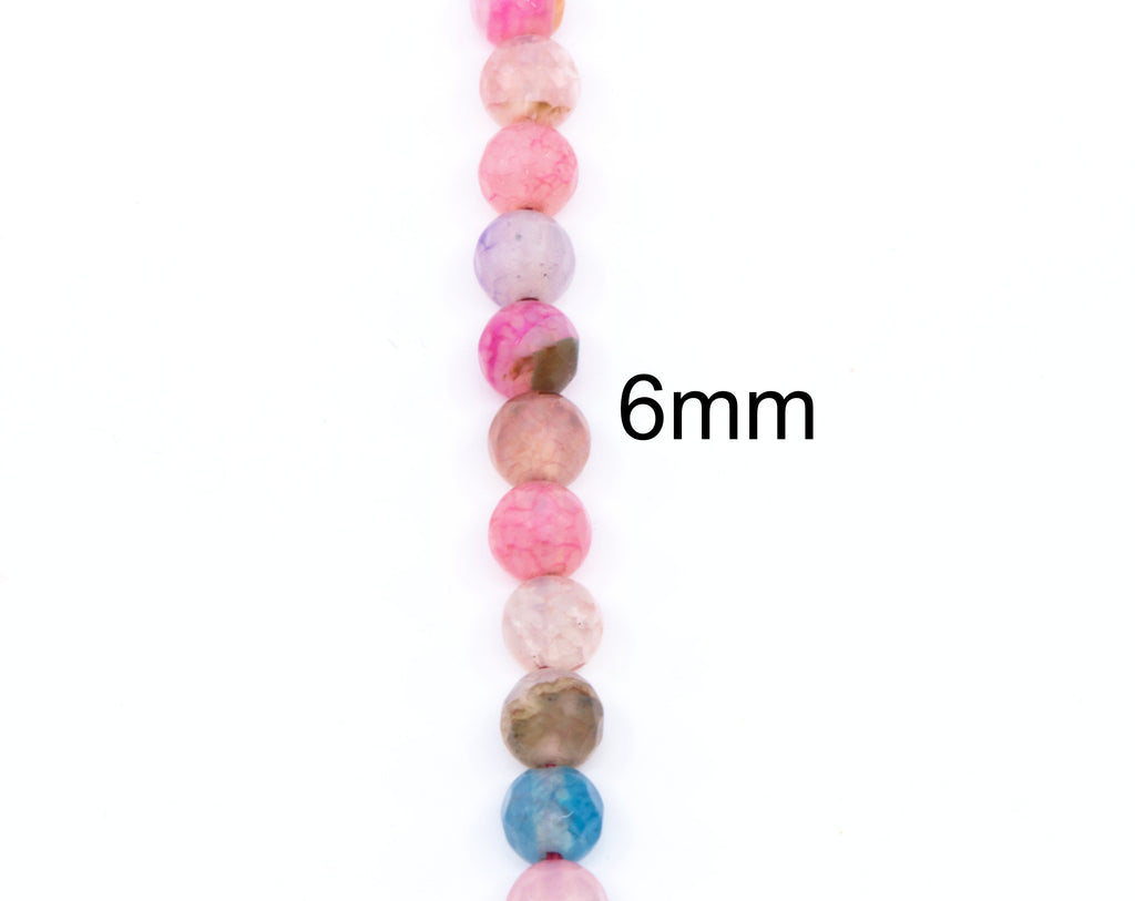 A vertical strand of round faceted agate beads in pink, lavender, peach, blue, and brown marbled colors on a white background, with the text '6mm' overlaid to indicate bead size.