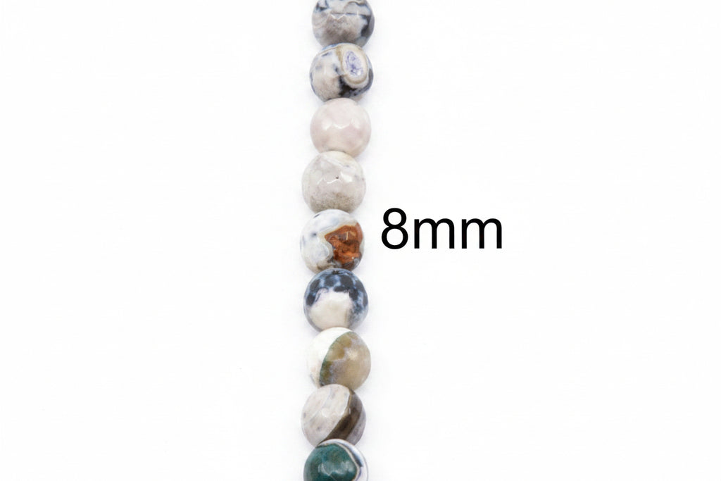 A vertical strand of round faceted agate  beads in white, black and blue, with a black text overlay reading '8mm' on a plain white background.