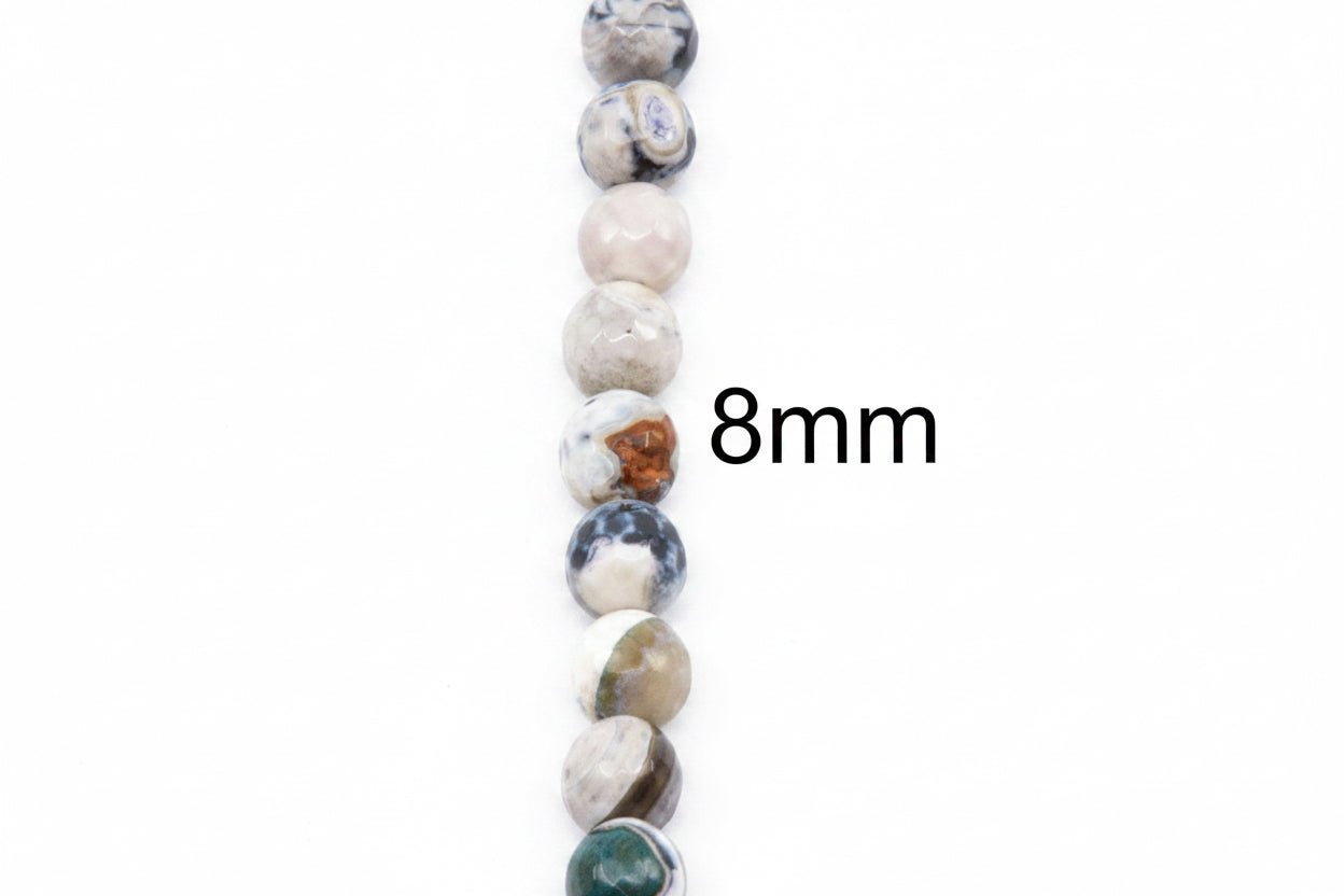 A vertical strand of round faceted agate  beads in white, black and blue, with a black text overlay reading '8mm' on a plain white background.