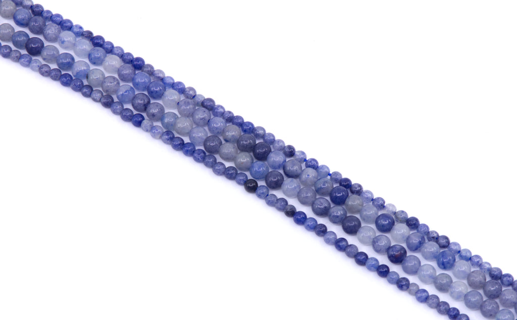 four strands of blue aventurine beads arranged diagonally on a white background.