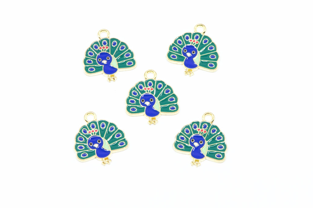 Five peacock-shaped jewelry charms with gold-tone metal borders and loops, featuring blue and green enamel detailing on a white background.