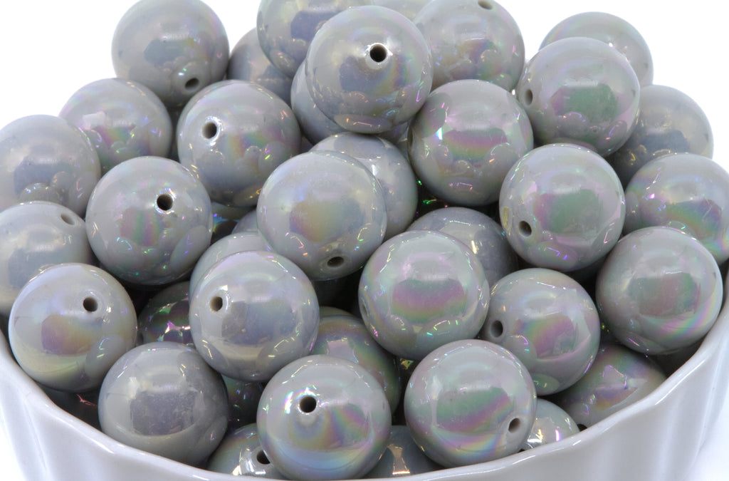  gray Iridescent round beads in a white bowl
