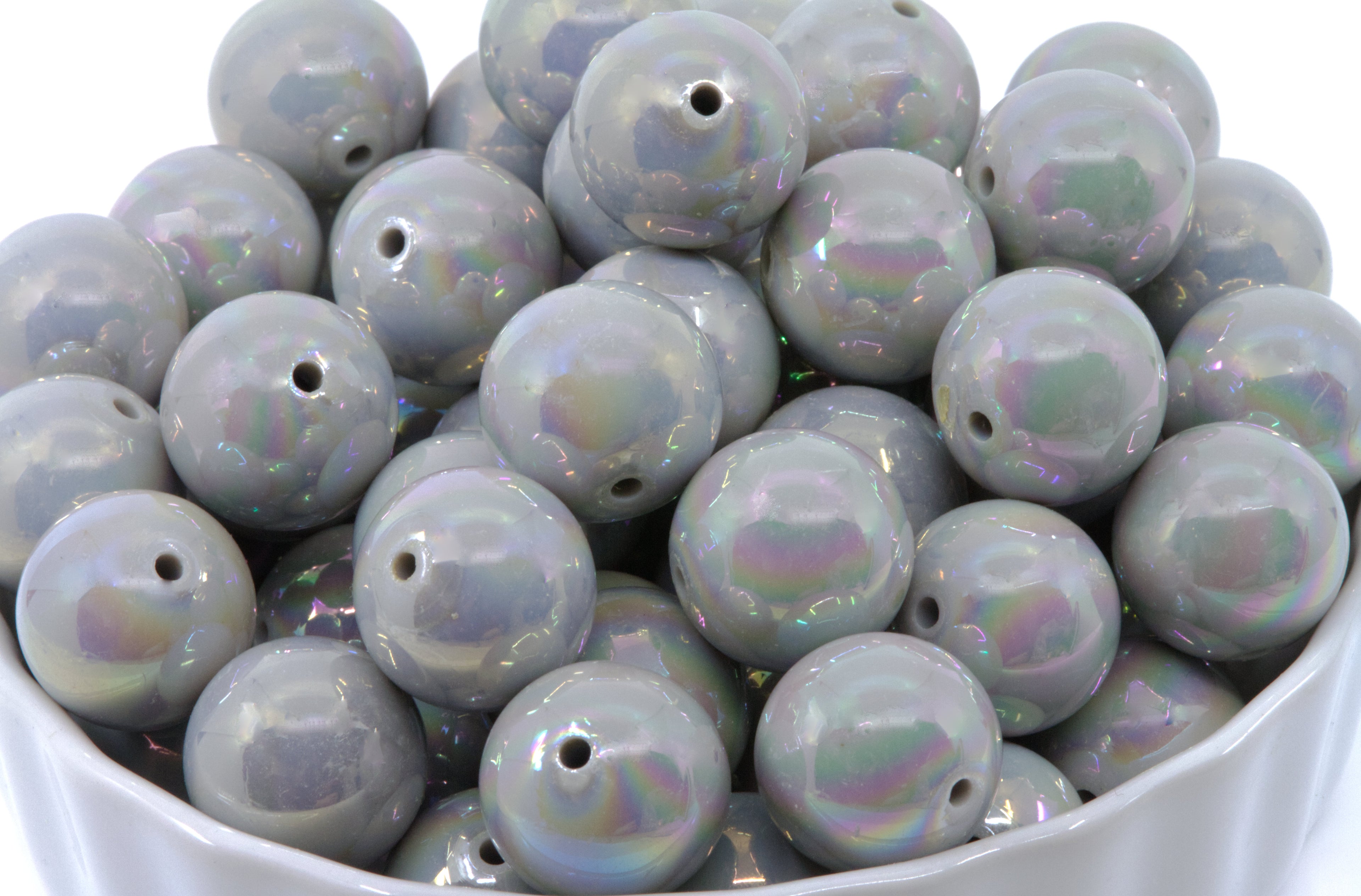  gray Iridescent round beads in a white bowl