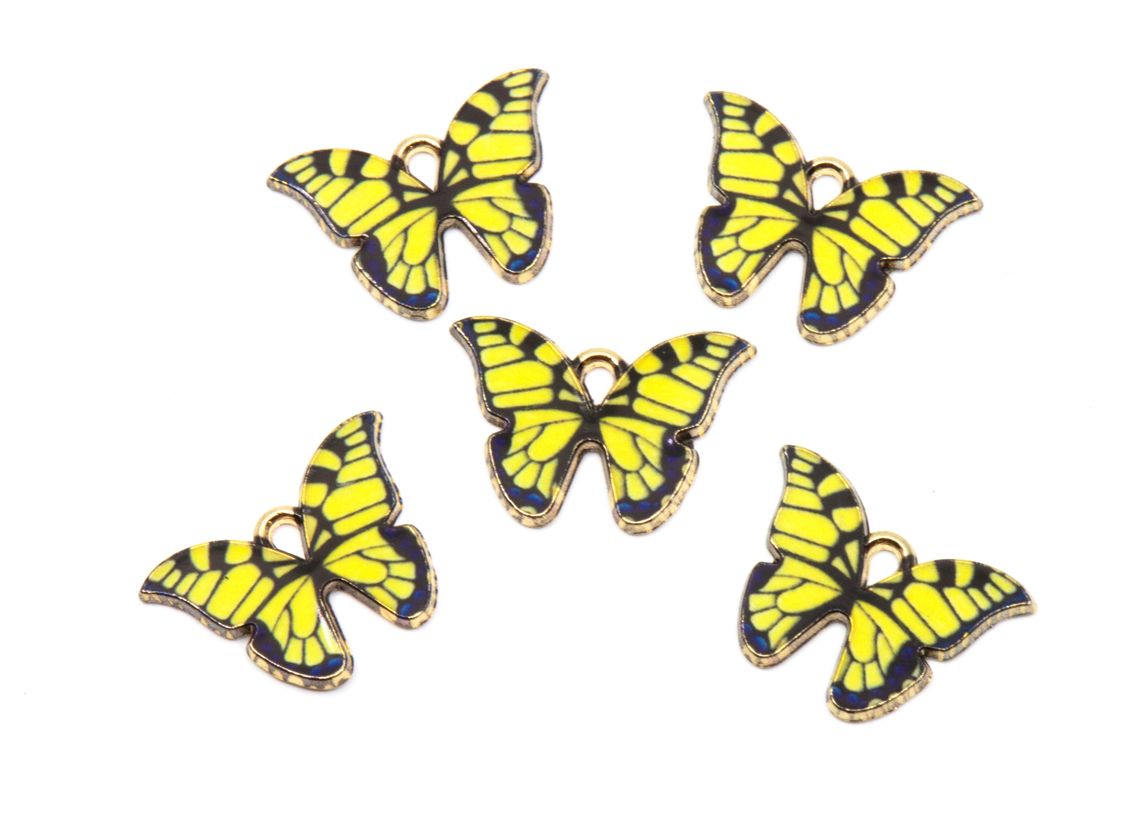 Five butterfly-shaped jewelry charms with bright yellow and black striped wings and gold-tone edges, arranged on a plain white background.