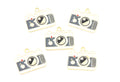 Five camera-shaped jewelry charms with gold-tone metal borders and dark gray enamel details, arranged on a plain white background.