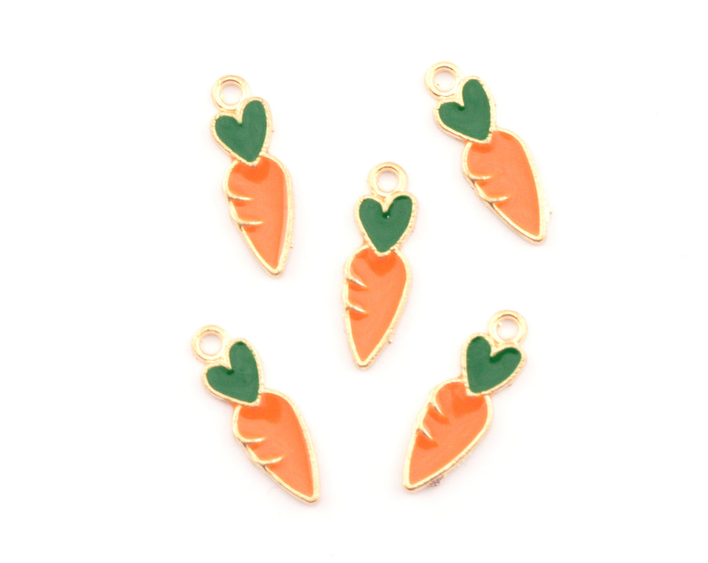 Five carrot-shaped jewelry charms with gold-plated edges, orange enamel bodies, and green enamel tops, arranged on a plain white background.