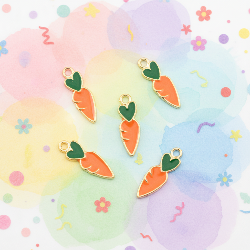 Five carrot-shaped jewelry charms with gold-tone edges, orange enamel bodies, and green leaf tops, arranged on a pastel watercolor background with small decorative flowers and squiggles.