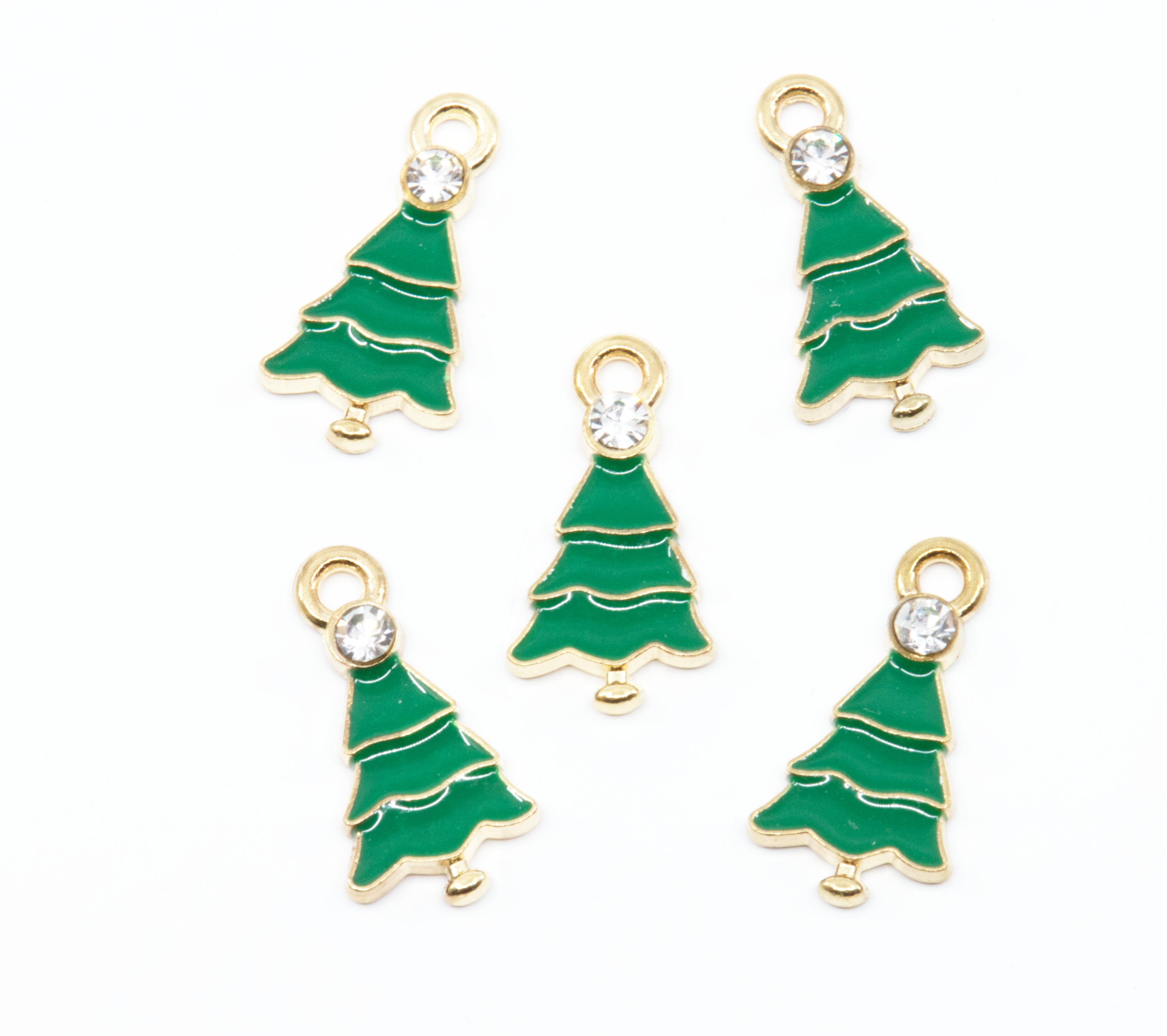 Five green Christmas tree charms with gold trim and a clear rhinestone at the top, arranged on a plain white background.