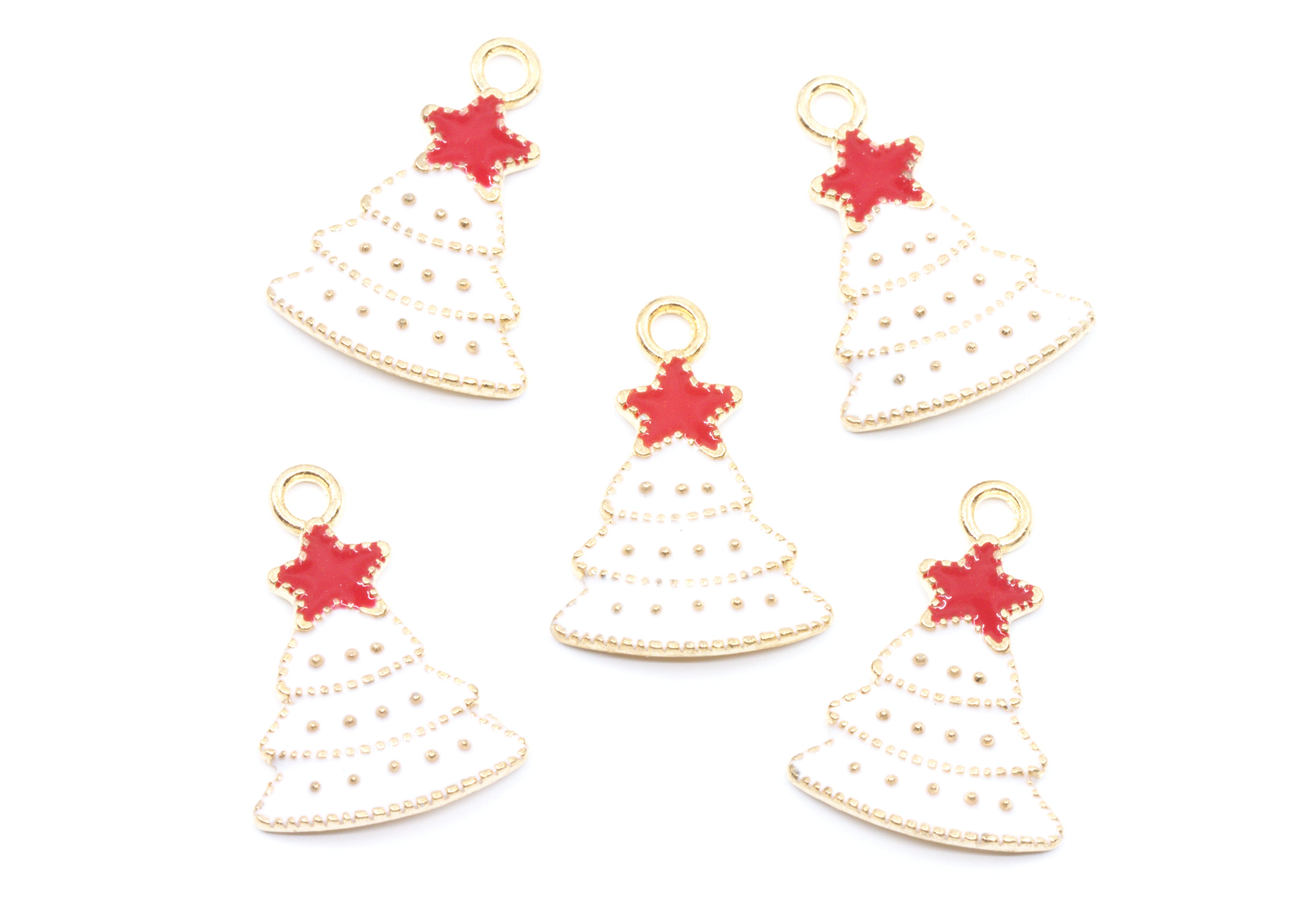 Five Christmas tree-shaped jewelry charms with gold-tone metal borders, white enamel fill, and red star toppers, arranged on a plain white background.