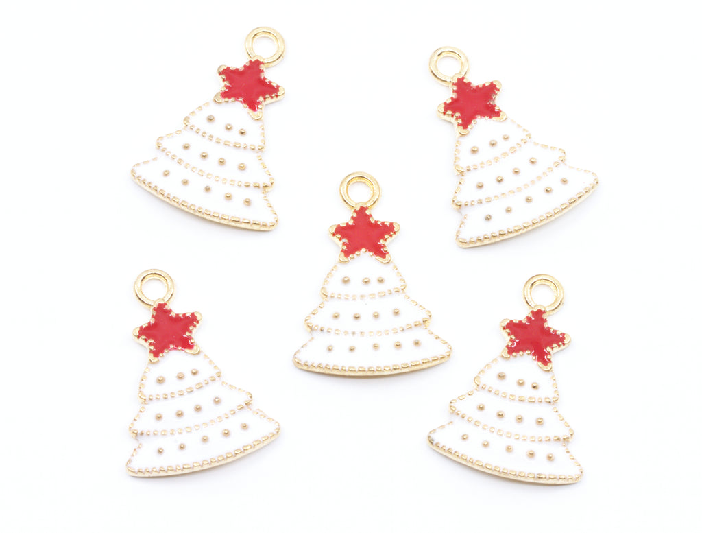 Five Christmas tree-shaped jewelry charms with gold-tone metal borders, white enamel fill, and red star toppers, arranged on a plain white background.