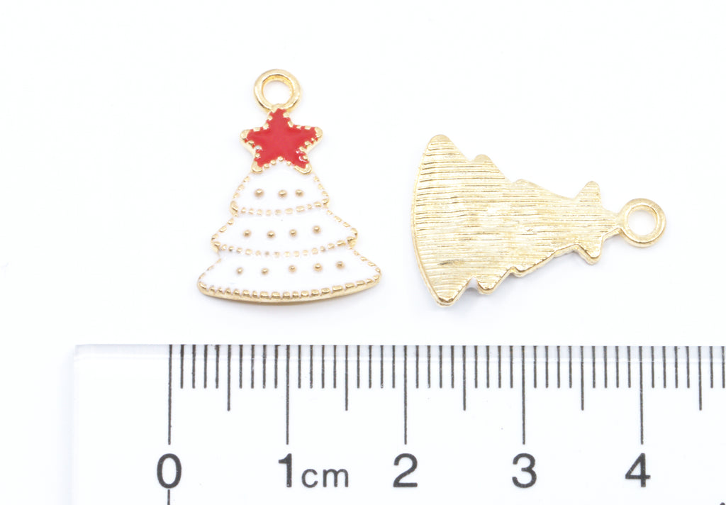 Two white Christmas tree with red star charms on a white background with a cm ruler at the bottom for scale. 