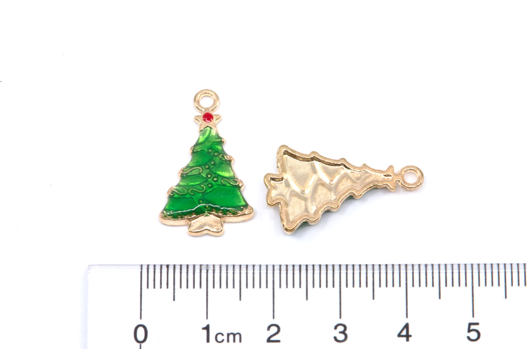 Two Christmas tree-shaped jewelry charms shown on a white background with a ruler at the bottom for scale. 